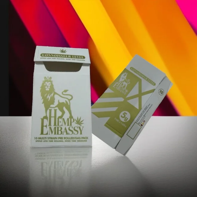 Custom cigarette box for CBD pre-rolls with a premium white and gold design, featuring the "Hemp Embassy" branding.
