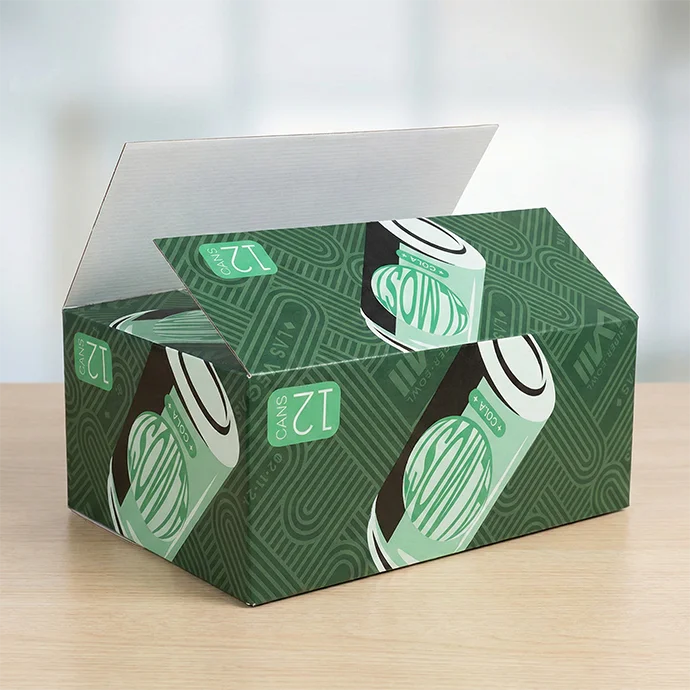 Custom printed green corrugated shipping box with soda can graphics on a wooden surface