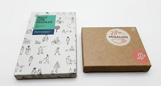 Side-by-side comparison of natural brown and bleached white kraft cardboard boxes, highlighting organic textures for eco-conscious USA brands.