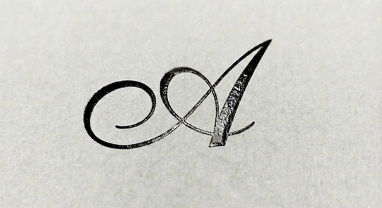 Deep black gloss foil stamping on a matte custom box for a stealth luxury brand aesthetic.