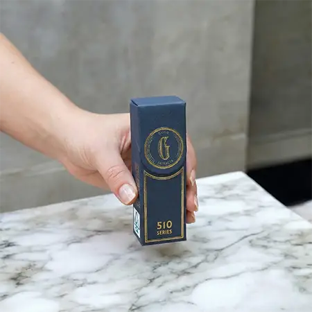 Luxury navy blue cigar box with ornate gold foil branding for Heritage Blends.